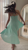 Girl twirling in year 6 turquoise graduation dress