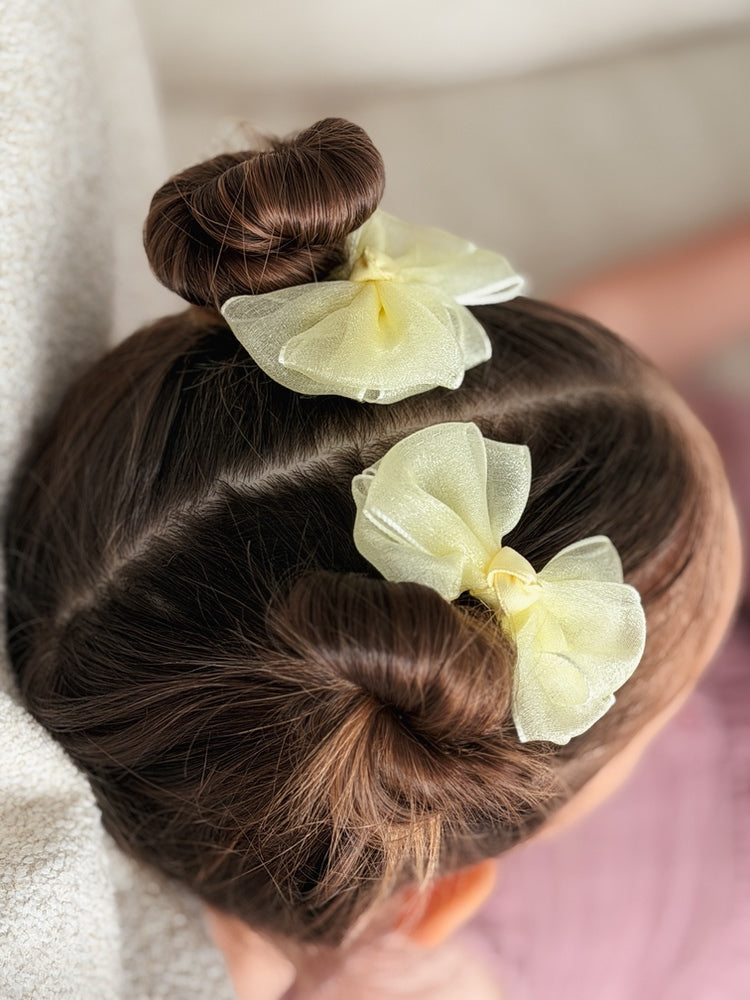 Girls yellow bow clips for special occasions